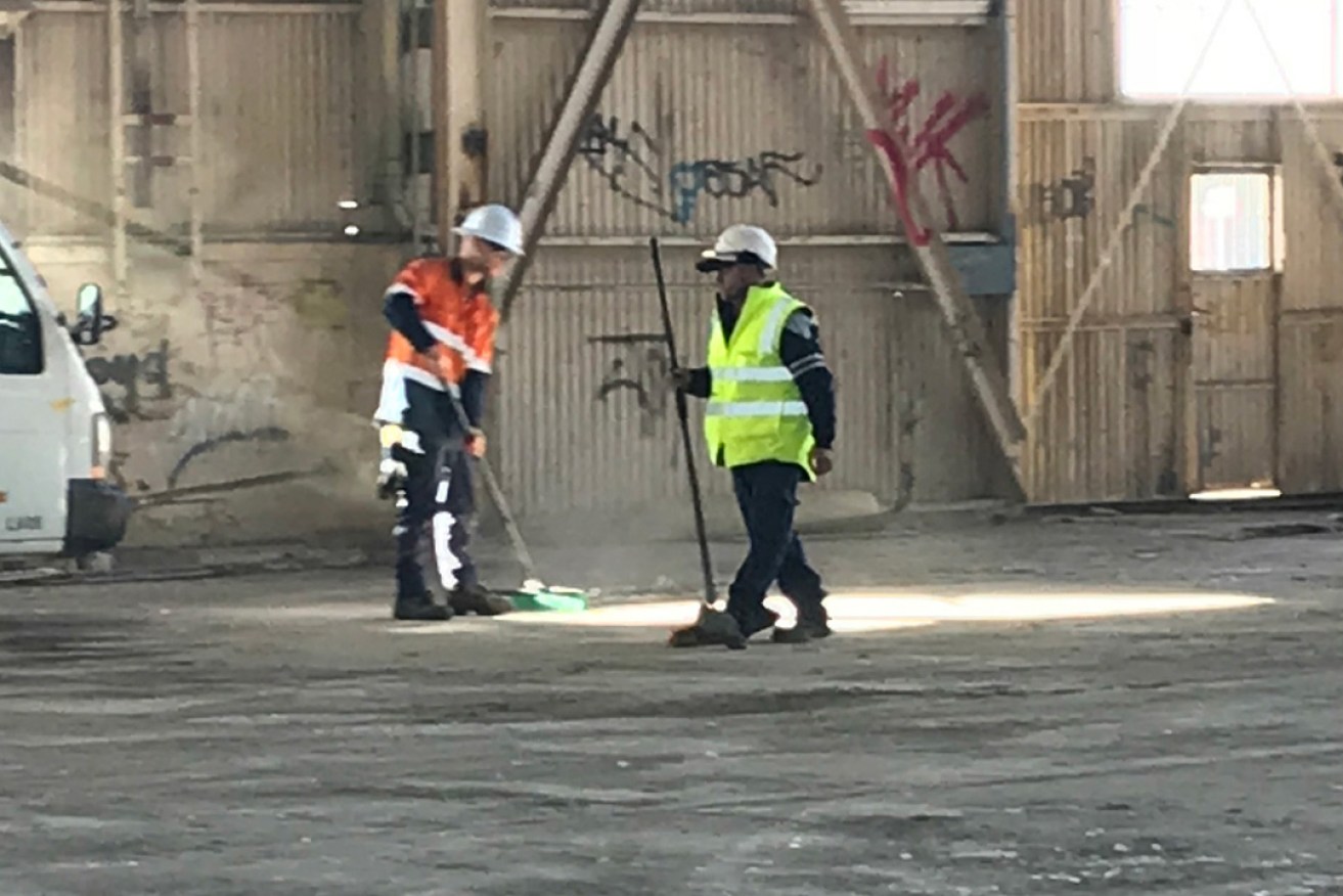CFMEU footage appears to show workers sweeping the floor of Shed 26, potentially making deadly asbestos fibres airborne. 