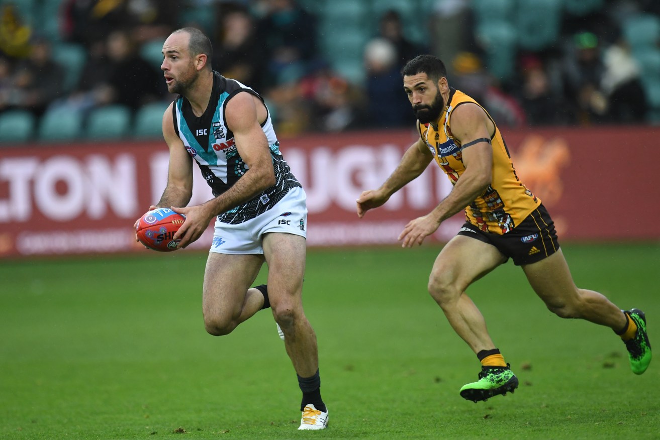 Port's Matthew Broadbent (left) will take indefinite time away from the game. Photo: Julian Smith / AAP