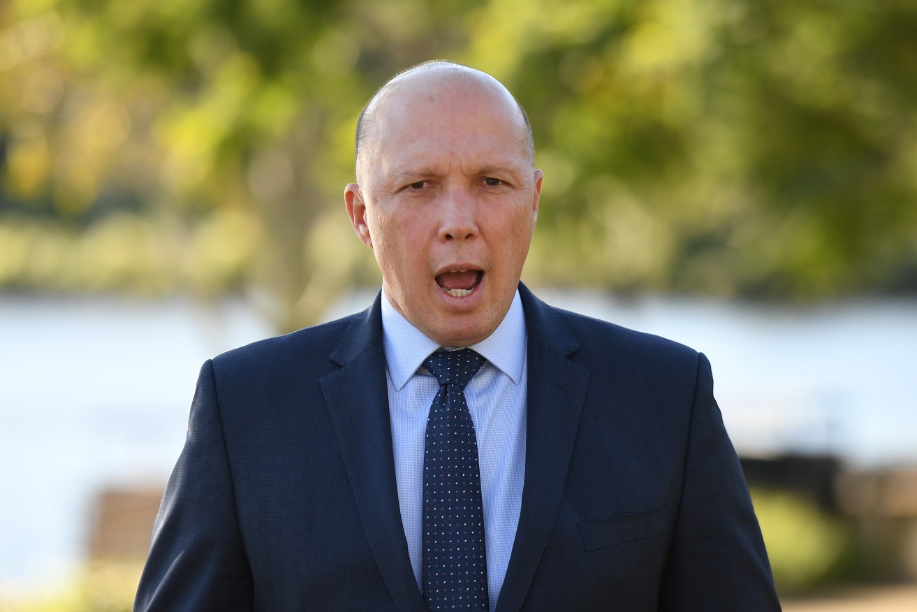 Home Affairs Minister Peter Dutton says whistleblowers have legal protection and the government defended media right. Photo: AAP/Dan Peled
