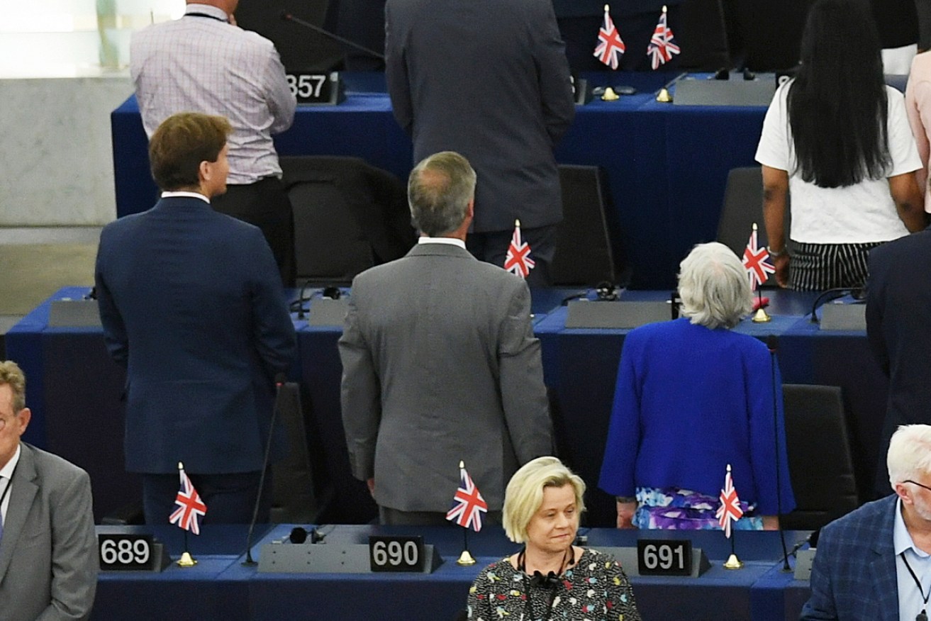 Nigel Farage and other Brexit Party MPs turn their backs as the EU anthem is played inside the European Parliament. Photo: supplied 