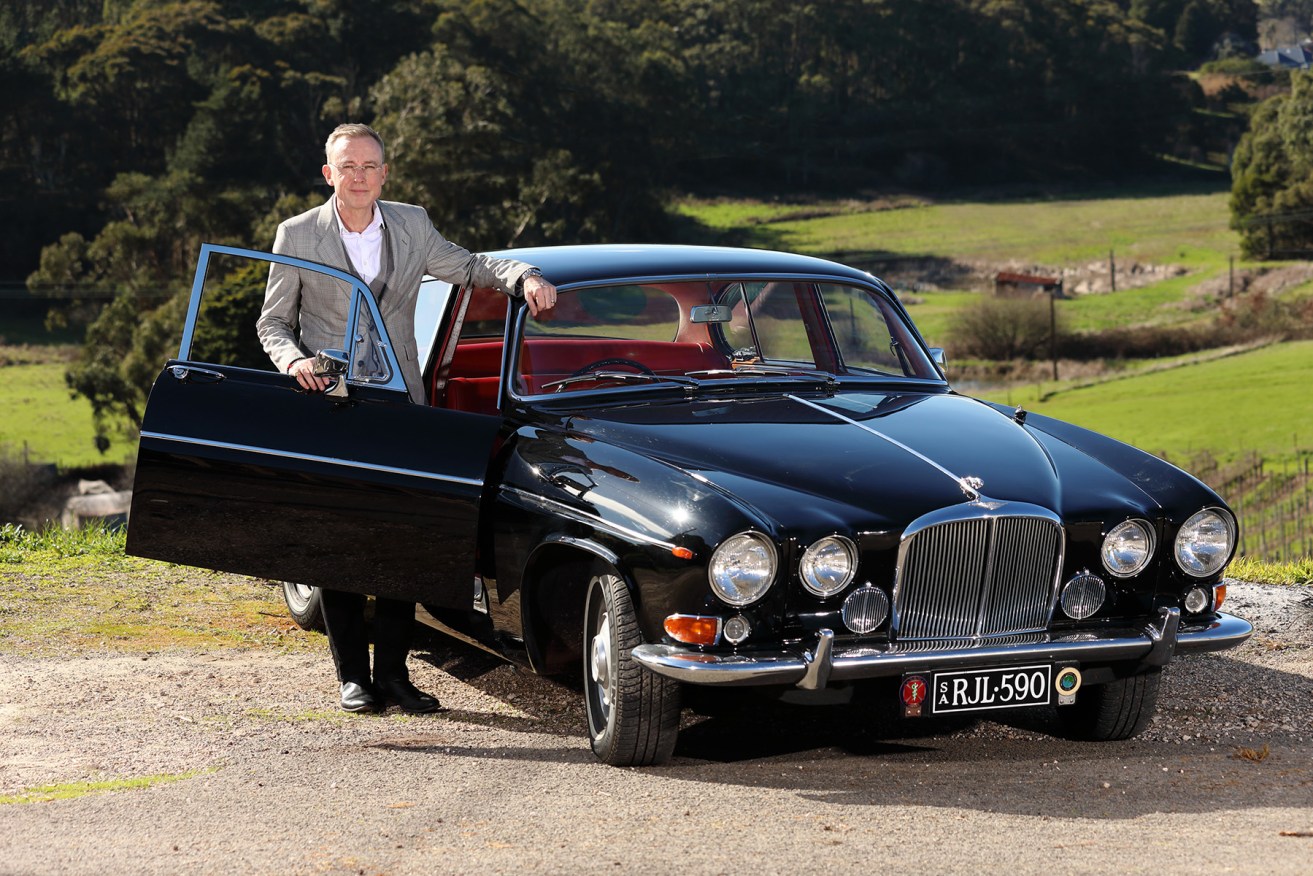 Martin Haese with one of his classic cars - a 1967 Jaguar 420G. Photo: Tony Lewis/InDaily