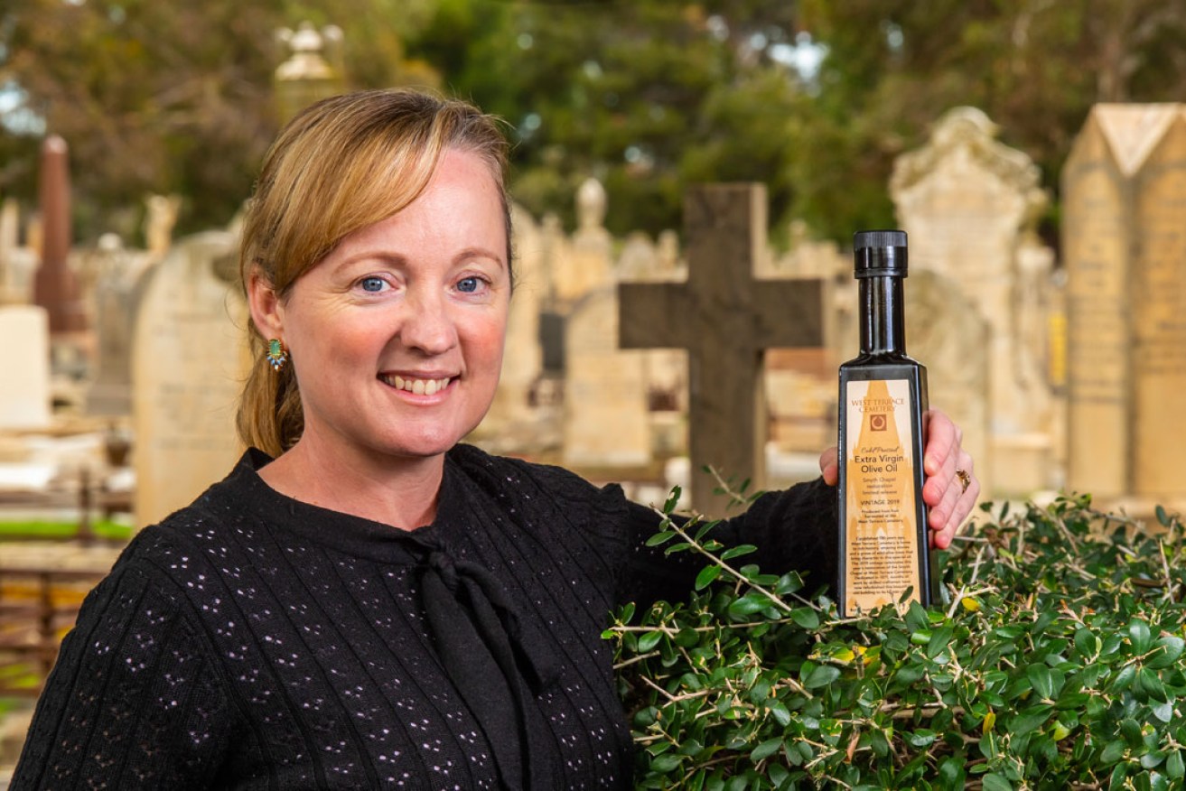 Adelaide Cemeteries Authority customer strategy coordinator Lisa Clarke with the olive oil. Photo: John Krüger