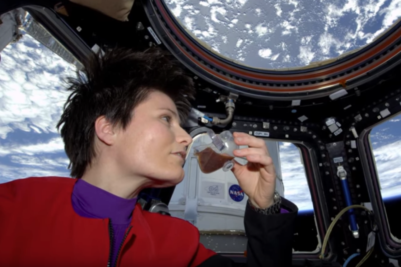 A screenshot from a NASA video demonstrating how liquids behave in a Zero-G environment. 