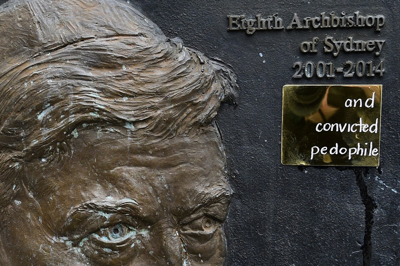 Addition to a George Pell plaque at Sydney's St Mary's Cathedral after he lost his appeal last week. Photo: AAP/Bianca De Marchi
