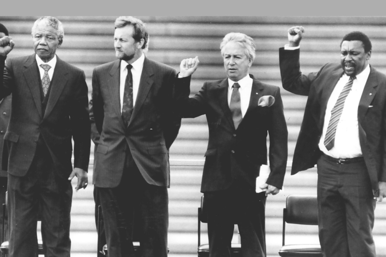 Crowning moment: Don Dunstan with Nelson Mandela, Gareth Evans and Eddie Funde on the steps of the Sydney Opera House in 1990. Photo: Steven Siewert / Fairfax Ltd.