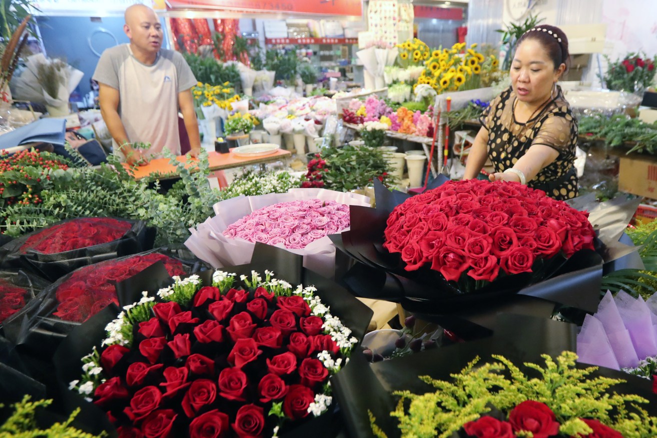 A flower market in China's Yunnan province, which has the perfect climate for growing roses. Photo: Yang zheng - Imaginechina/Sipa USA