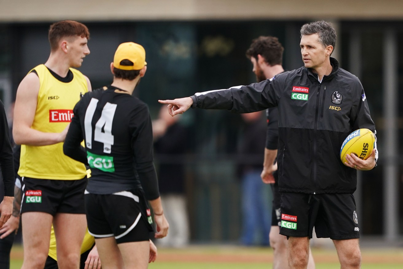 Justin Longmuir (right) overseeing a Collingwood training session last month. Photo: Michael Dodge / AAP