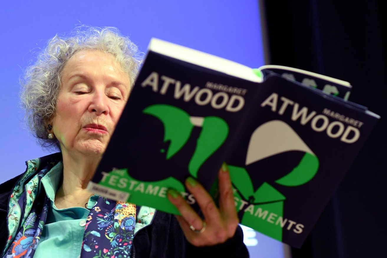 Canadian author Margaret Atwood with her new book The Testaments. Photo: EPA
