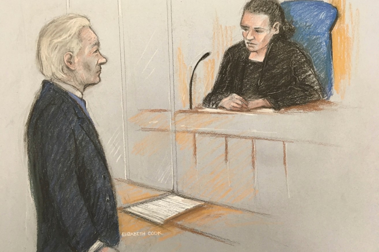 Julian Assange's lawyers say he has been denied a computer and access to documents while imprisoned and preparing for a US extradition hearing. Image: Elizabeth Cook/PA via AP