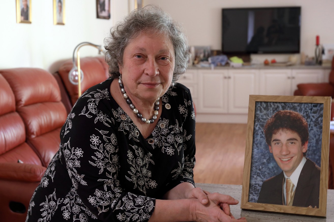 LifeLine volunteer Angela Henwood with a portrait of her son, Jonathan, who died in 2008. Photo: Tony Lewis