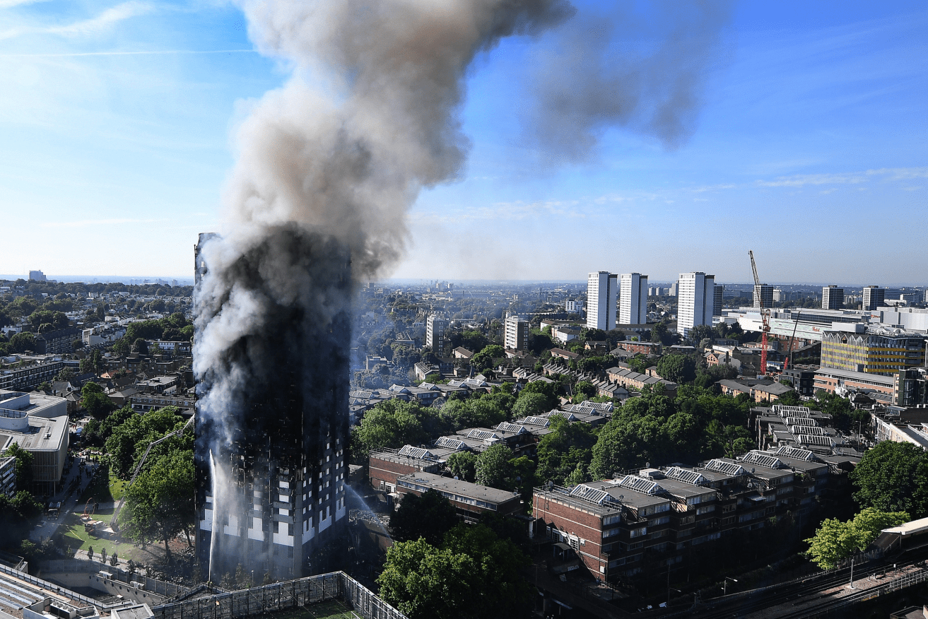 Smoke billows from the fire that engulfed London's 24-storey Grenfell Tower in 2017. Photo: Andy Rain / EPA