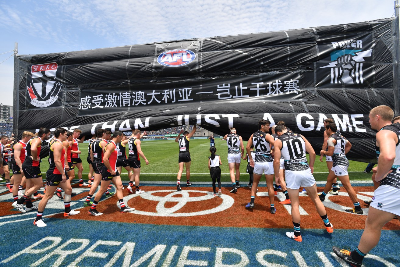 Players take the field before this year’s Shanghai fixture. Photo: David Mariuz / AAP