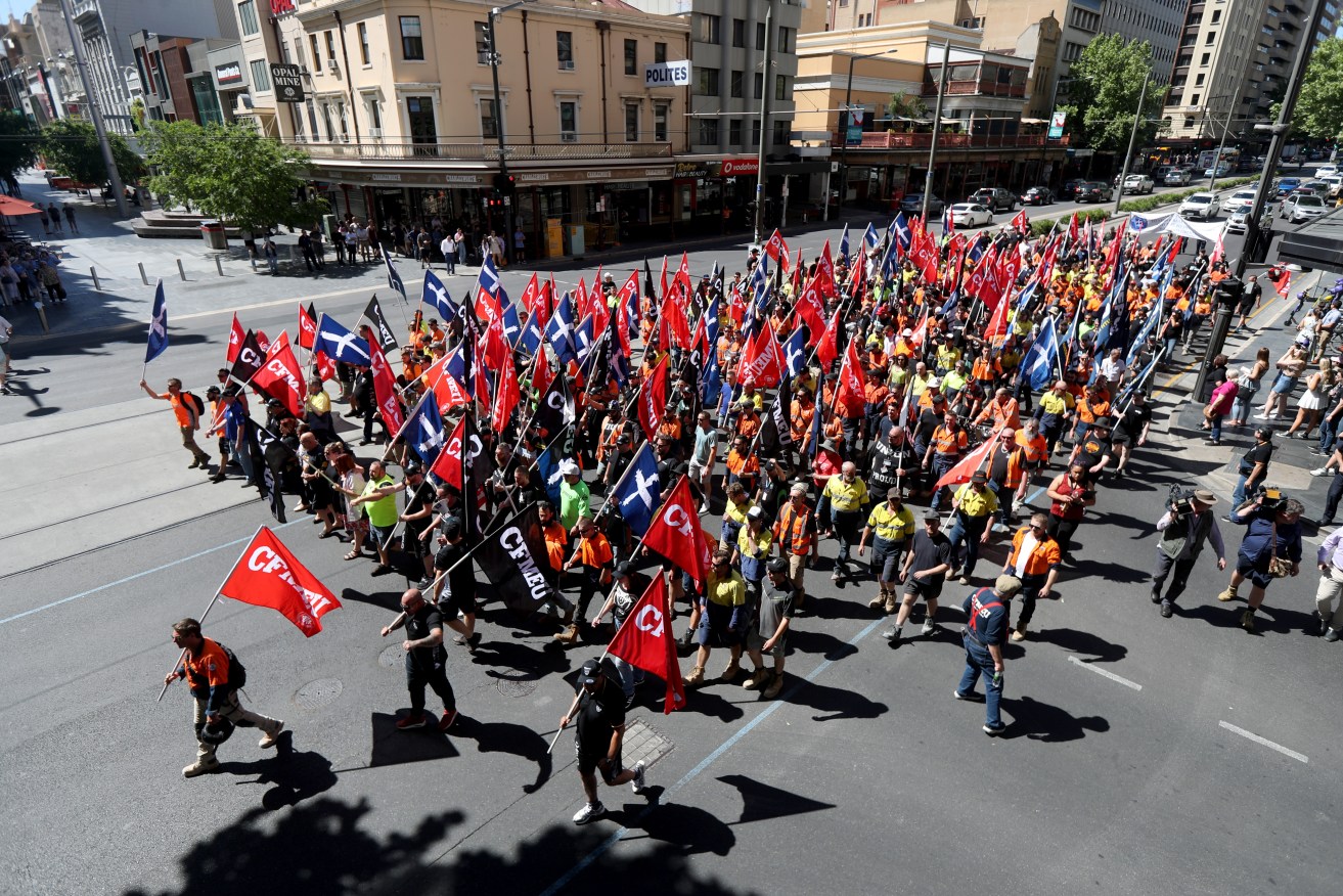 CFMEU members marched in Adelaide in October to call for SA industrial manslaughter laws. Photo: AAP/Kelly Barnes