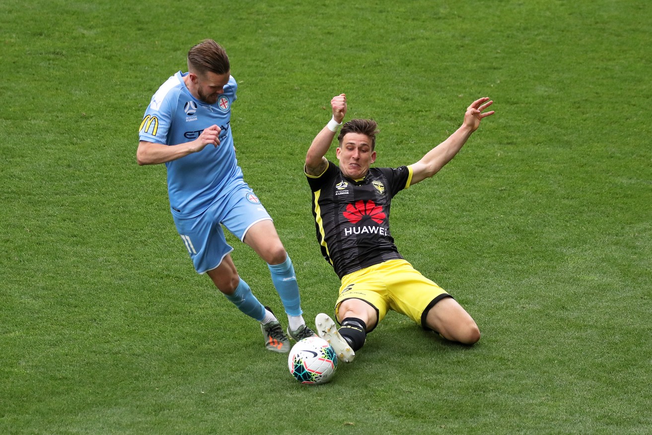 Louis Fenton of Wellington Phoenix (right) has been embroiled in yet another VAR controversy. Photo: AAP/George Salpigtidis