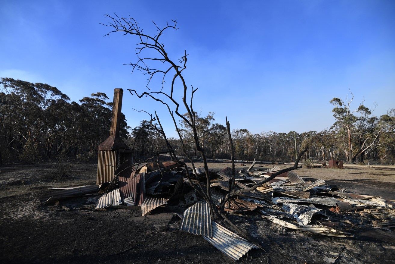 Two people died and homes were destroyed around the NSW town of Glen Innes. Photo: AAP/Dan Peled