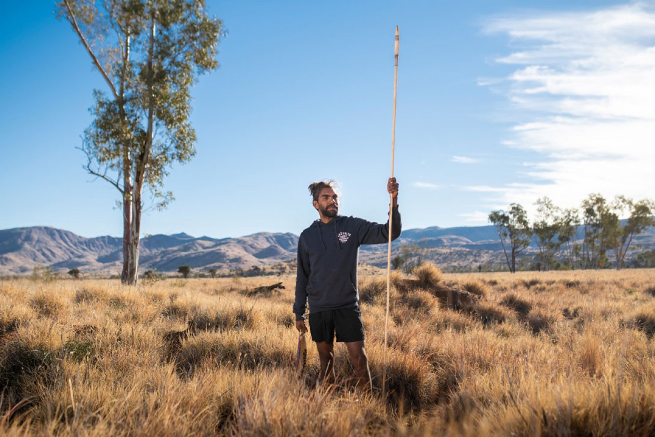 Anwar Young of Tjala Arts on country near Amata in the APY Lands. Photo: Rohan Thompson 
