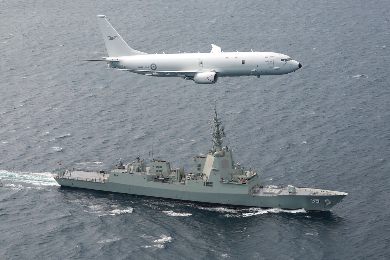 A RAAF P-8A Poseidon supports sea trials for the NUSHIP Hobart in Gulf St Vincent off the coast of Adelaide. Picture: Craig Barrett/Department of Defence