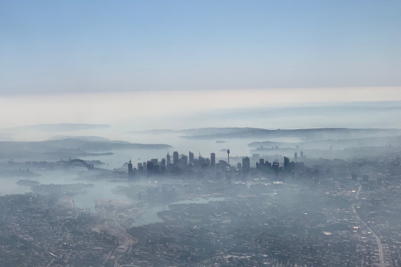 Smoke haze blanketing Sydney: record dry spring weather set the scene for the bushfire crisis. Photo: AAP/Neil Bennett