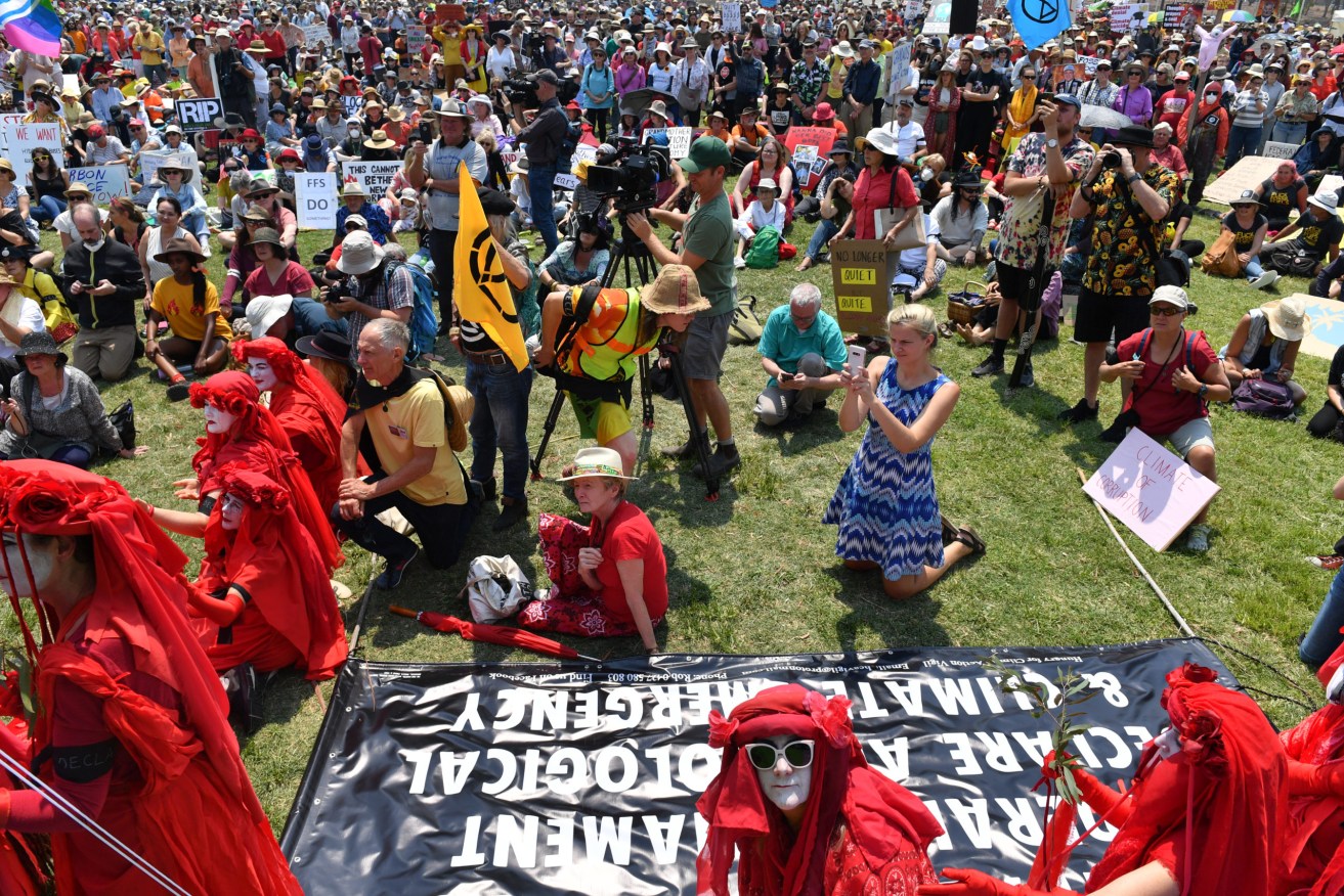 Climate change activists protest outside Parliament House in Canberra yesterday. Photo: AAP/Mick Tsikas