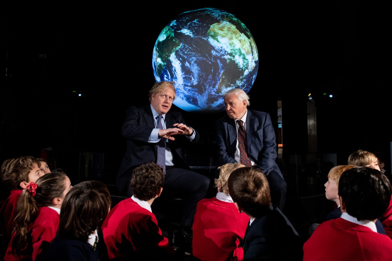 British Prime Minister Boris Johnson (left) and Sir David Attenborough alongside school children at the launch of the next COP26 UN Climate Summit at the Science Museum in London. Photo: Chris J Ratcliffe/PA Wire