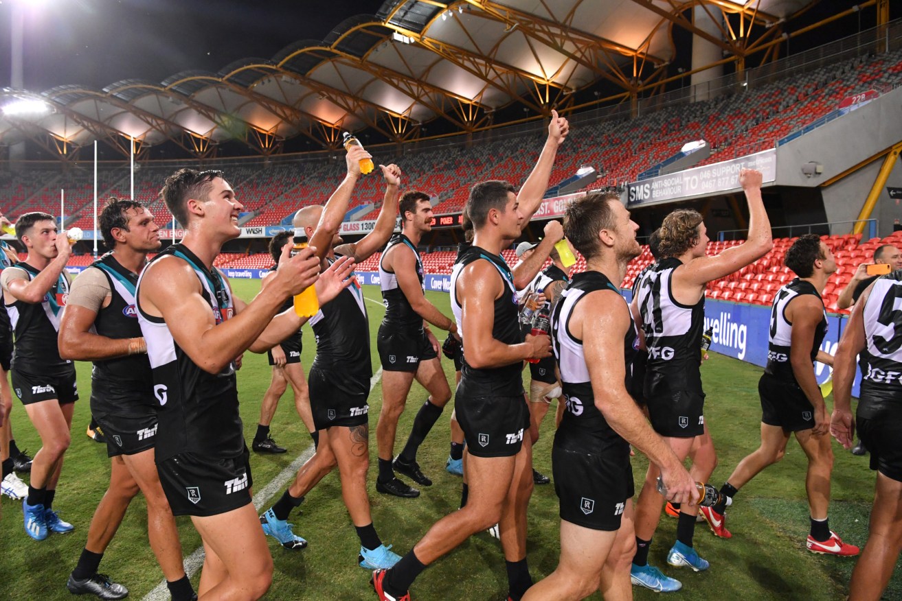 Port Adelaide after winning the Round 1 match at an empty stadium before the AFL season was suspended. Photo: AAP/Darren England