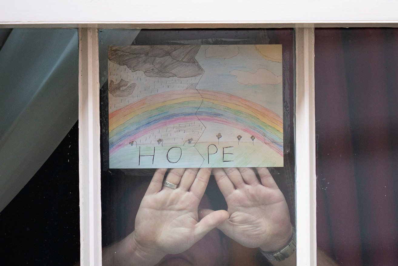 A 6-year-old's drawing of a rainbow with the word "Hope" is displayed in a window of 10 Downing Street in London, as Prime Minister Boris Johnson remains in hospital. Photo: Aaron Chown / PA via AP