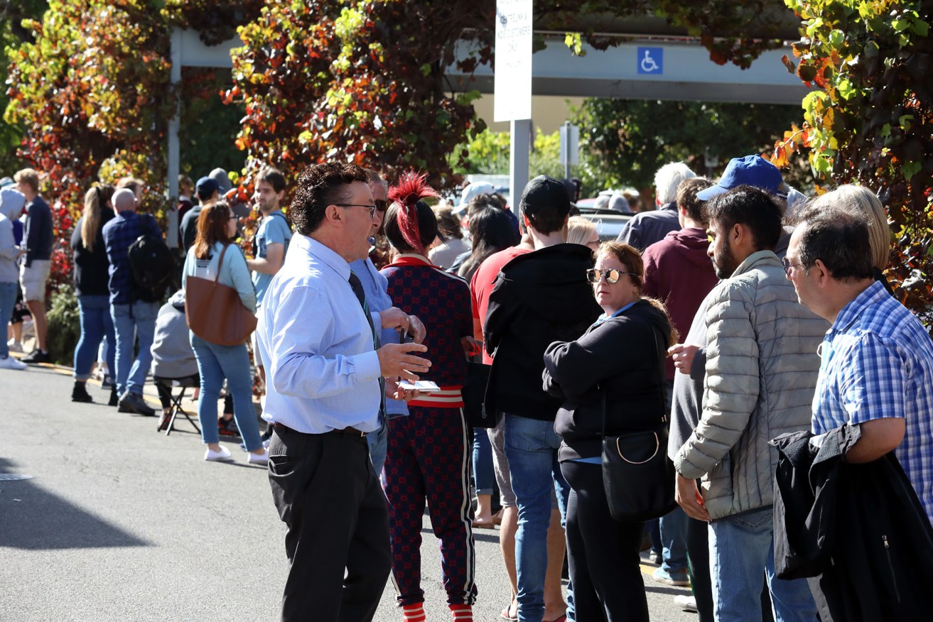 People queue at Centrelink's Norwood office. Photo: Tony Lewis/InDaily