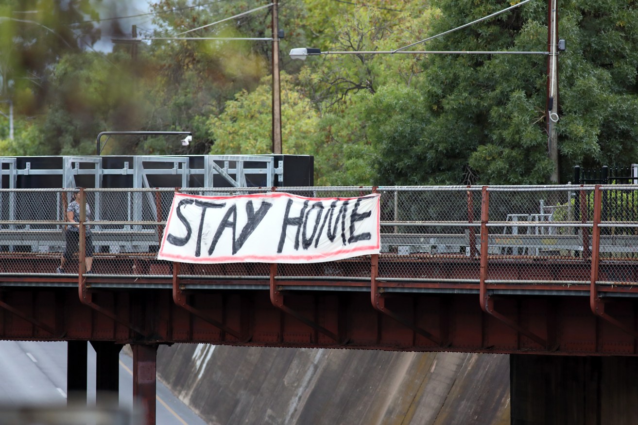 A banner on the Goodwood Rd train overpass. Photo: Tony Lewis/InDaily