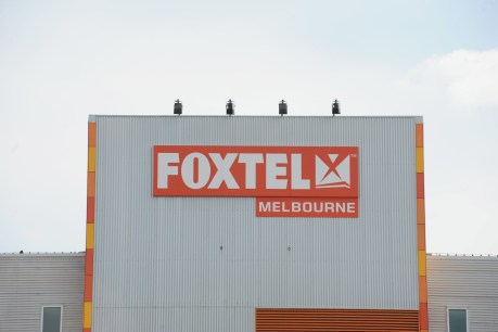 Telstra cops hit after News Corp slashes Foxtel value