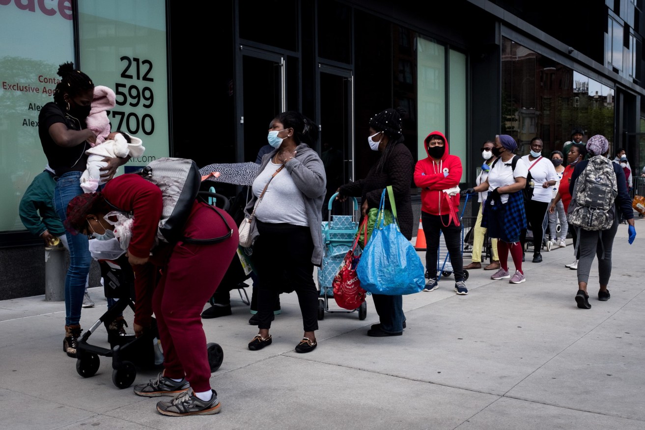 A queue for food parcels in New York. Photo: EPA/Alba Vigaray
