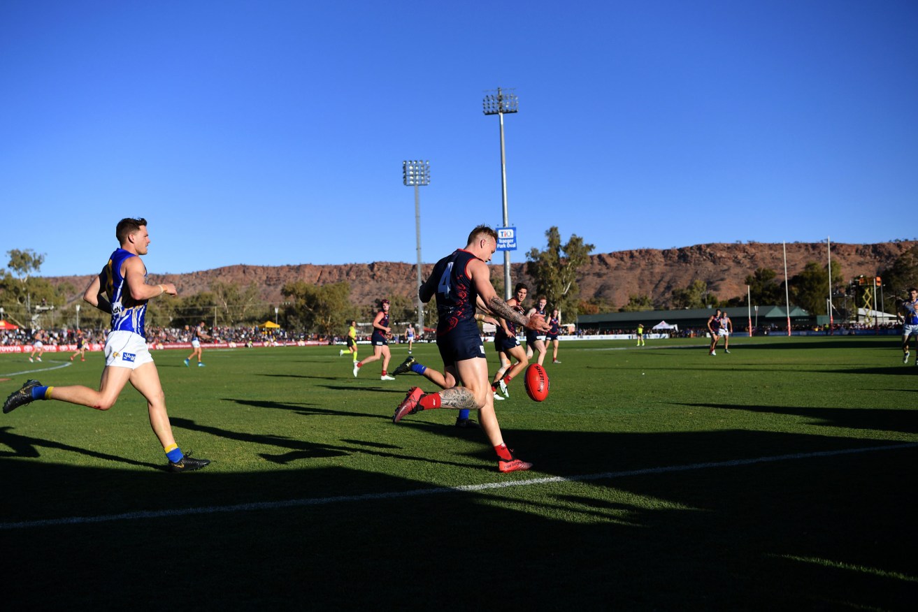 The AFL might play more games in Alice Springs, like last year's clash between Melbourne and  West Coast. Photo: AAP Image/Dan Peled