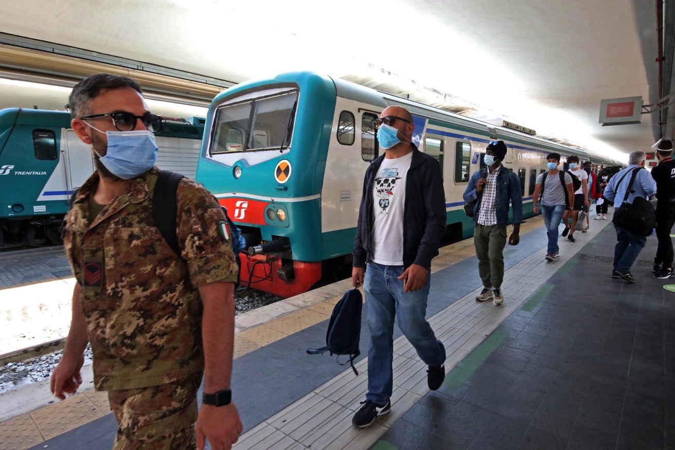 Passengers at Naples Central Station after Italy allowed travel between regions after a three-month lockdown. Photo: supplied
