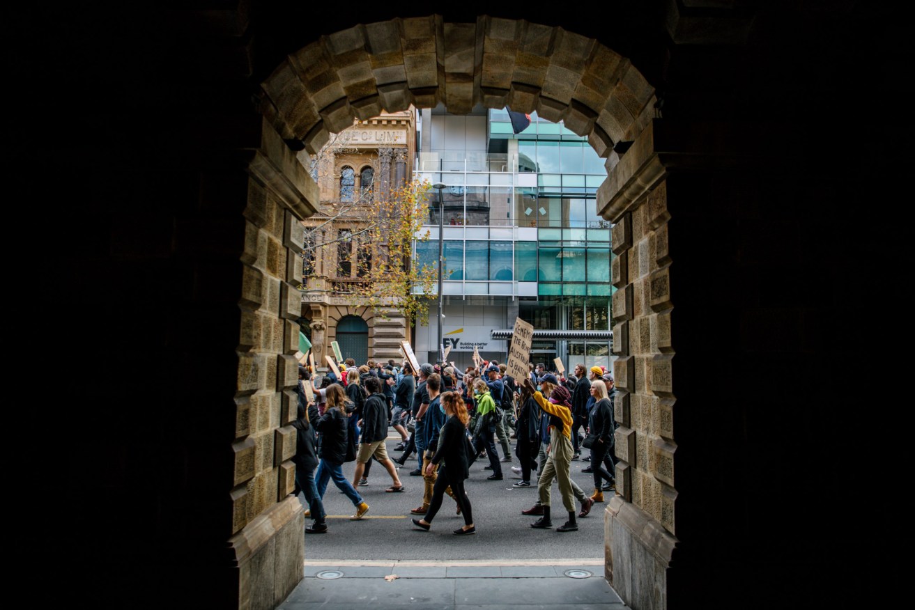 Health authorities are watching to see if Saturday's protests, like this one in Adelaide, will lead to a spike in COVID-19. Photo: AAP/Morgan Sette