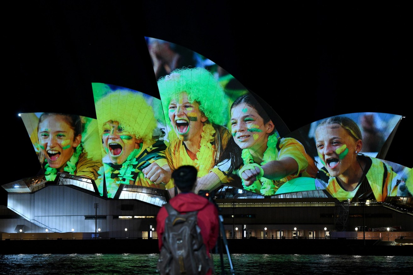 The Sydney Opera House illuminated last night in support of Australia and New Zealand’s joint bid to host the FIFA Women’s World Cup. Photo: AAP/Bianca De Marchi