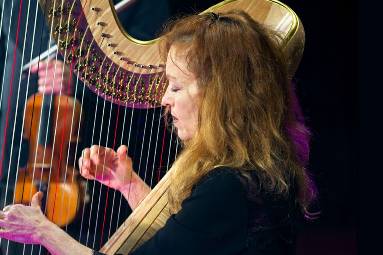 Suzanne Handel playing the ASO's gold harp for the Virtual Concert Hall.