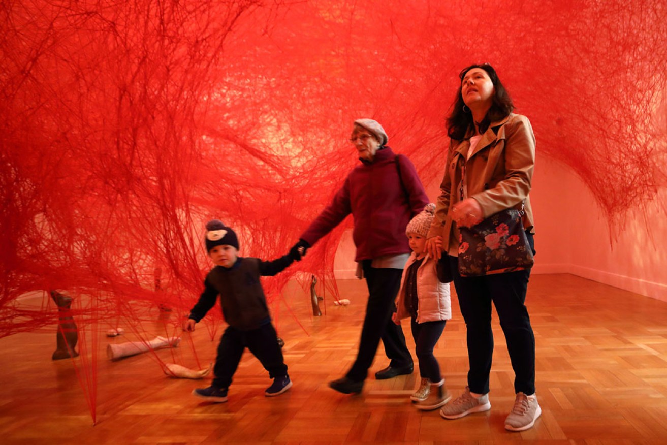 First visitors: Mollie Muncey, daughter Sarah and grandchildren Max and Mia explore Chiharu Shiota's 'Absence embodied' in the reopened AGSA this morning. Photo: Tony Lewis / InDaily