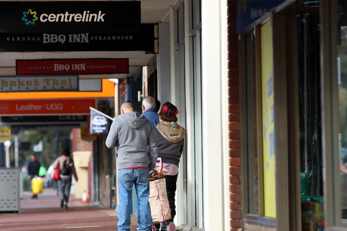 Queuing outside Glenelg Centrelink office. Photo: Tony Lewis/InDaily