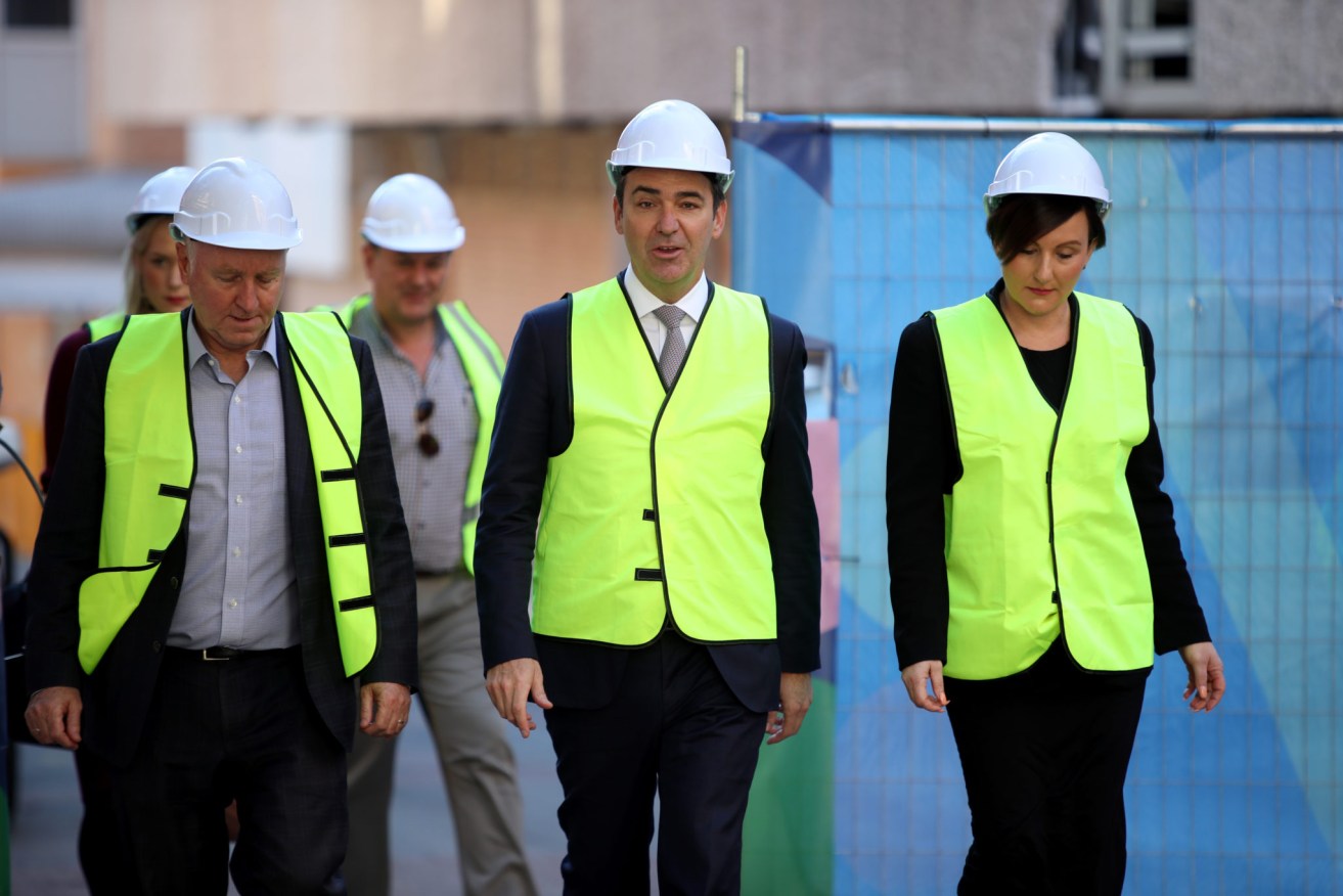 Former Renewal SA executive Georgina Vasilesvki, right, with former CEO John Hanlon (left) and Premier Steven Marshall (centre) at the Lot Fourteen site in May 2018. Photo: Kelly Barnes / AAP