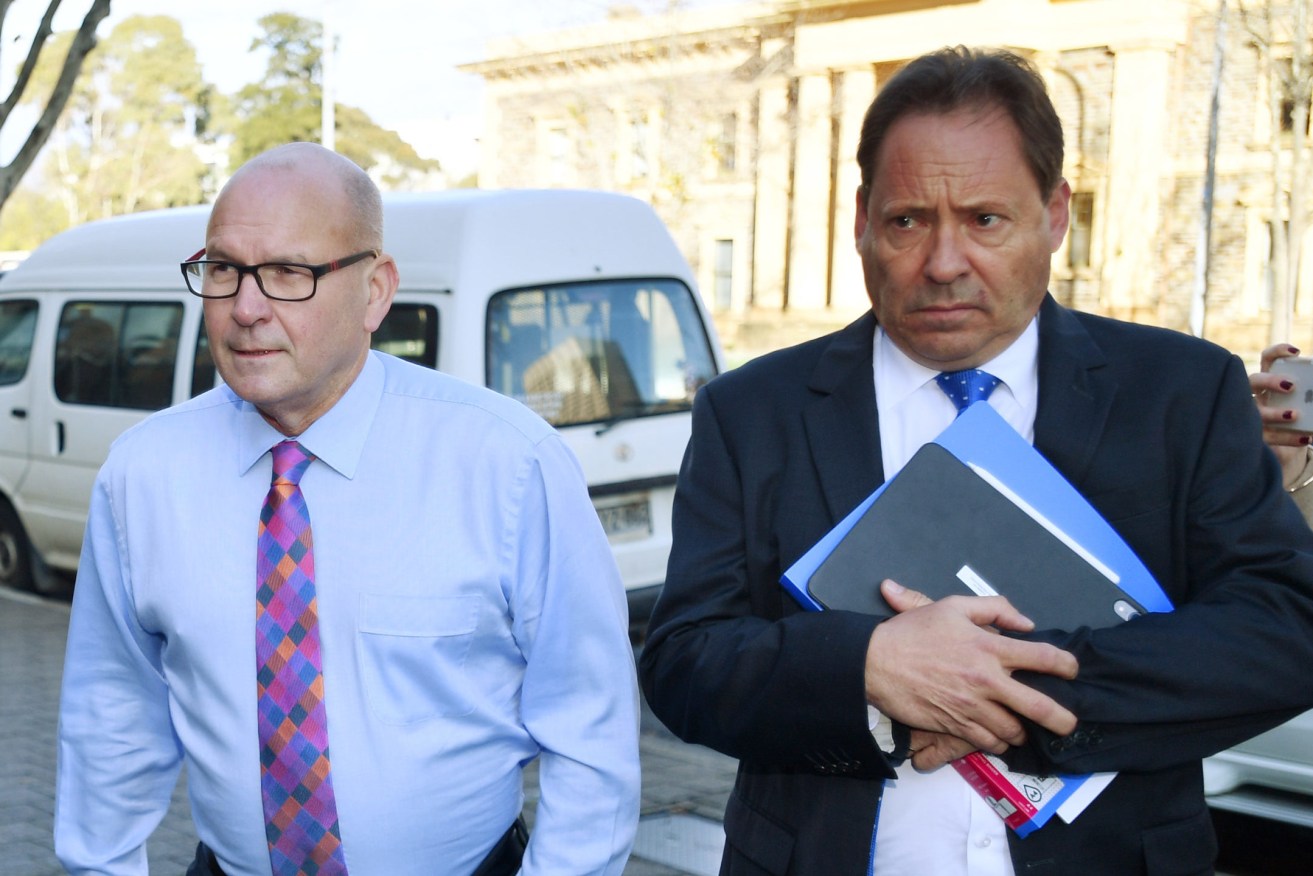 Bob Harrap (left) arrives at the Adelaide Magistrates Court on Monday. Photo: AAP/David Mariuz
