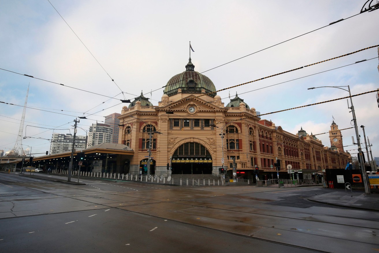 Melbourne's normally bustling Flinders Street Station. Photo: AAP/Daniel Pockett