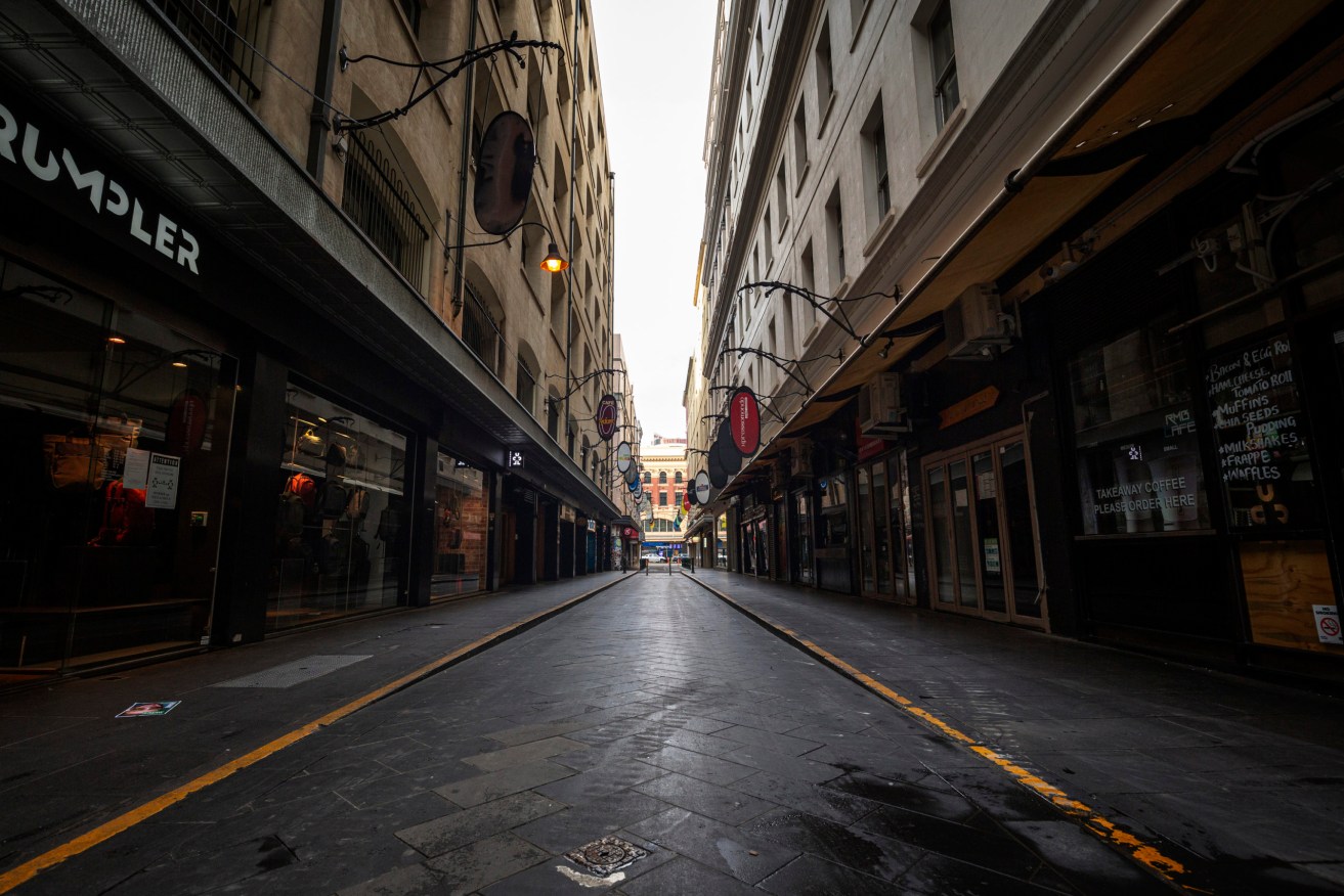 Empty streets in locked-down Melbourne. Photo: AAP/Daniel Pockett