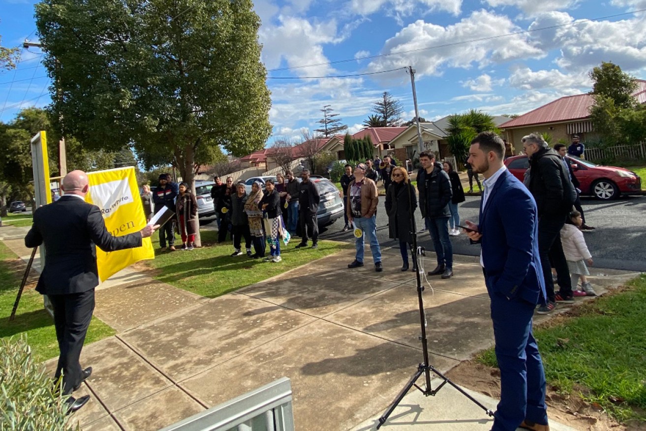 Ray White auctioneer John Morris in action at a recent auction in Adelaide.