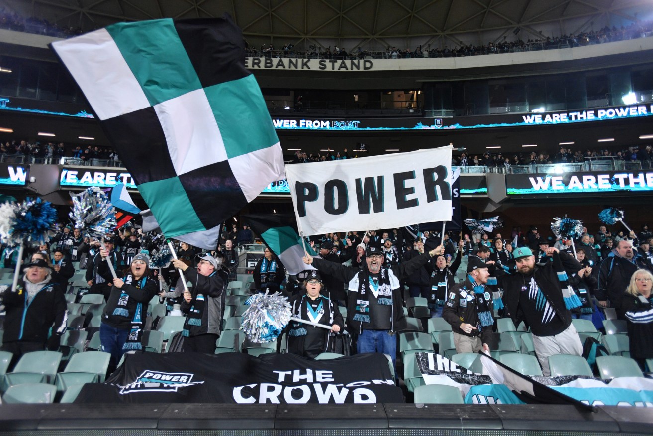 Port fans during the August match against Richmond at Adelaide Oval. Photo: AAP/David Mariuz