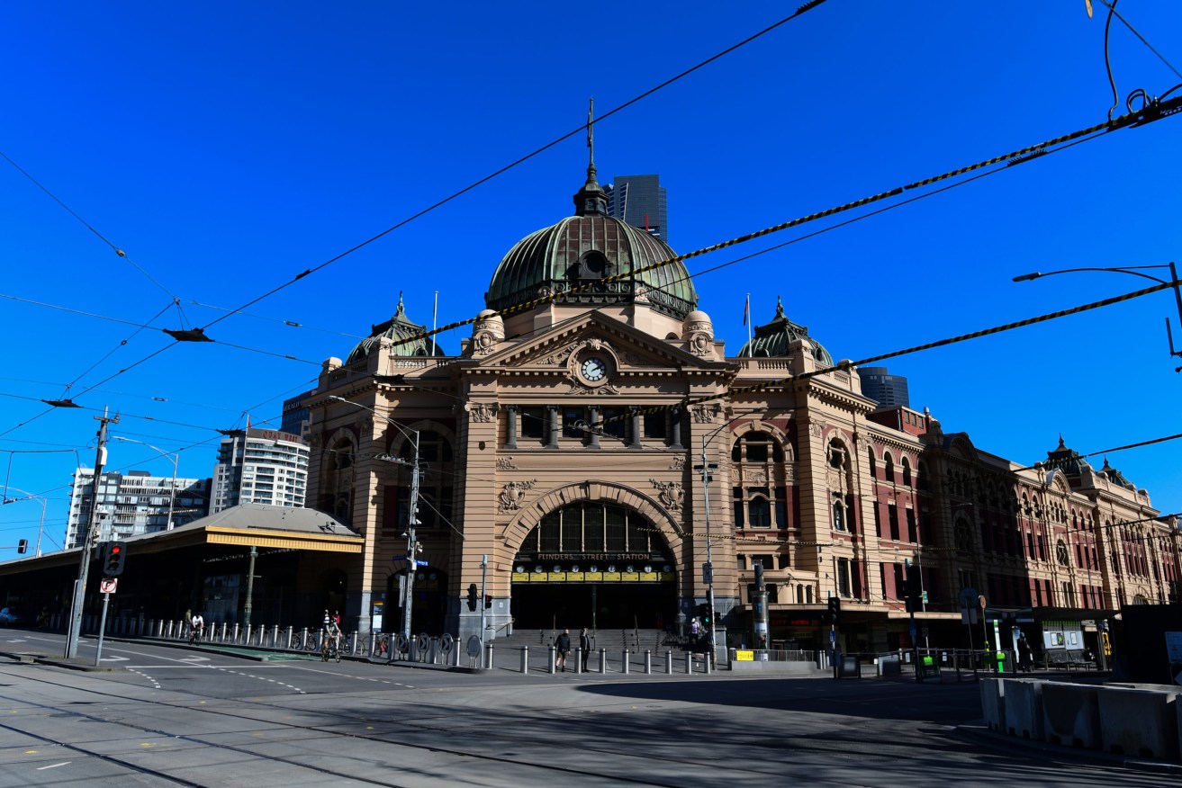 Melbourne's once-bustling Flinders Street Station is deserted. Photo: AAP/Erik Anderson