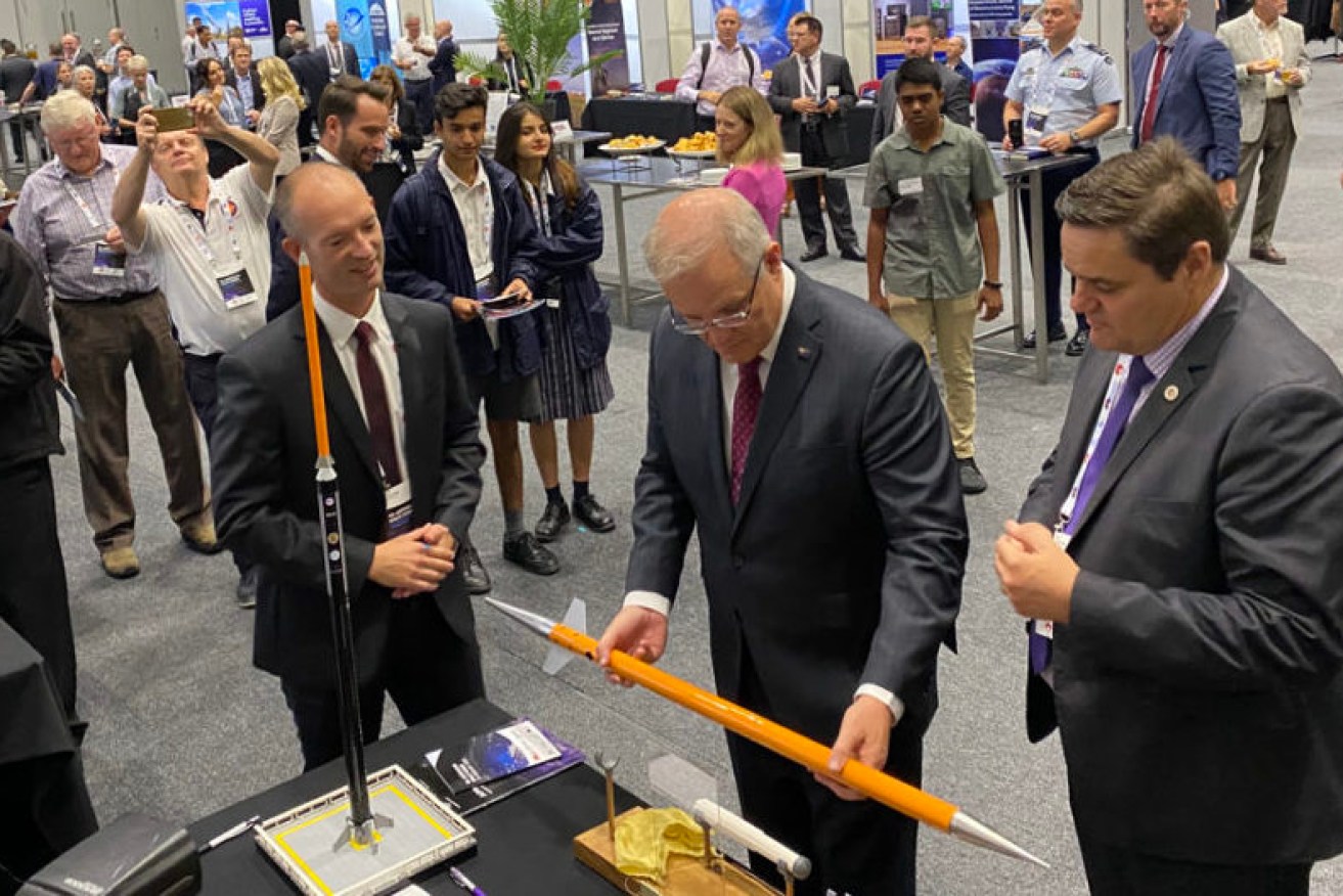 Prime Minister Scott Morrison, centre, joined Lloyd Damp of Southern Launch, left, and Ian Spencer of DEWC Systems at the 9th Australian Space Forum in Adelaide in February. Damp and Spencer have continued their collaboration and will launch Australia's first NewSpace rocket in SA next month.