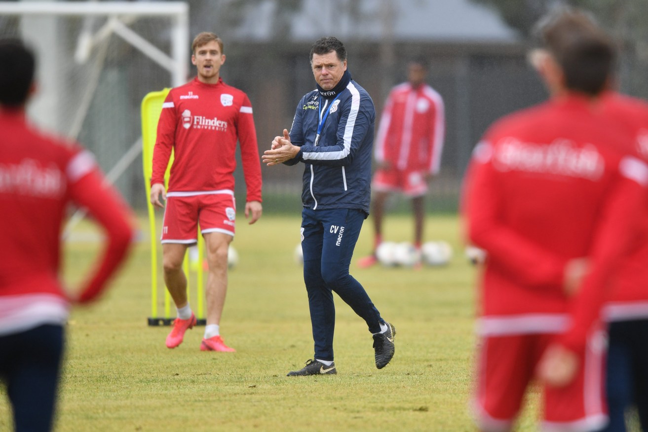 Adelaide United coach Carl Veart should have a competitive squad for next season, but uncertainties are swirling around Australian football. Photo: AAP/David Mariuz