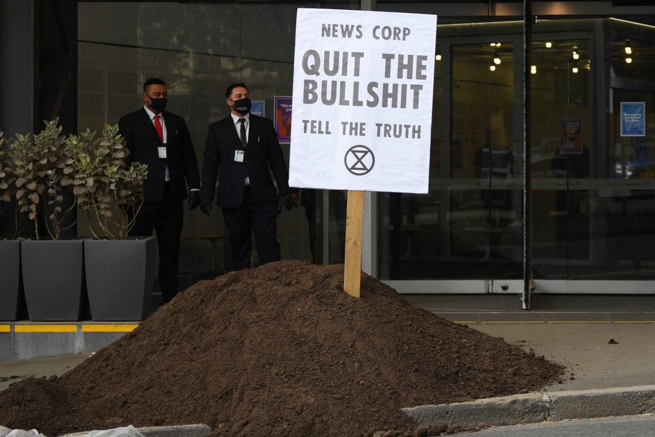 A pile of “manure” is dumped outside the News Corp Australia offices in Sydney. Photo: AAP/Dean Lewins