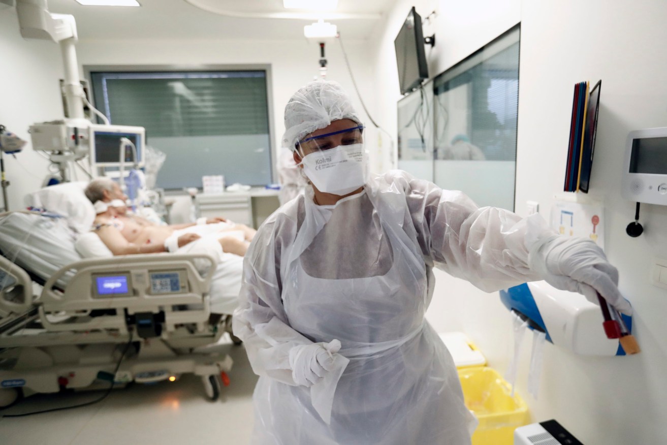 A coronavirus patient is treated at a hospital in Marseille. Photo:EPA/Guillaume Horcajuelo 