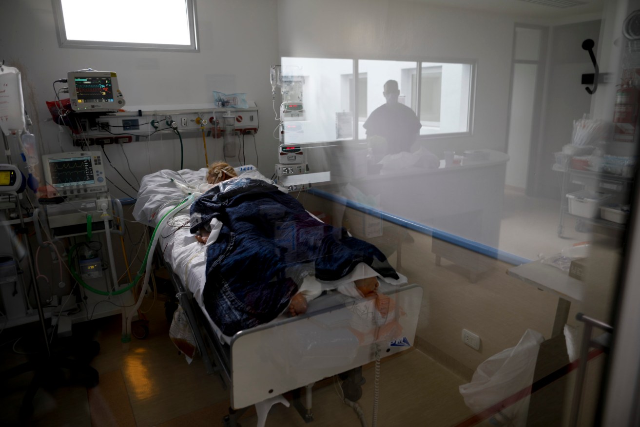 A COVID-19 patient lies in the intensive care unit of a hospital in Buenos Aires, Argentina. Photo: AP/Natacha Pisarenko