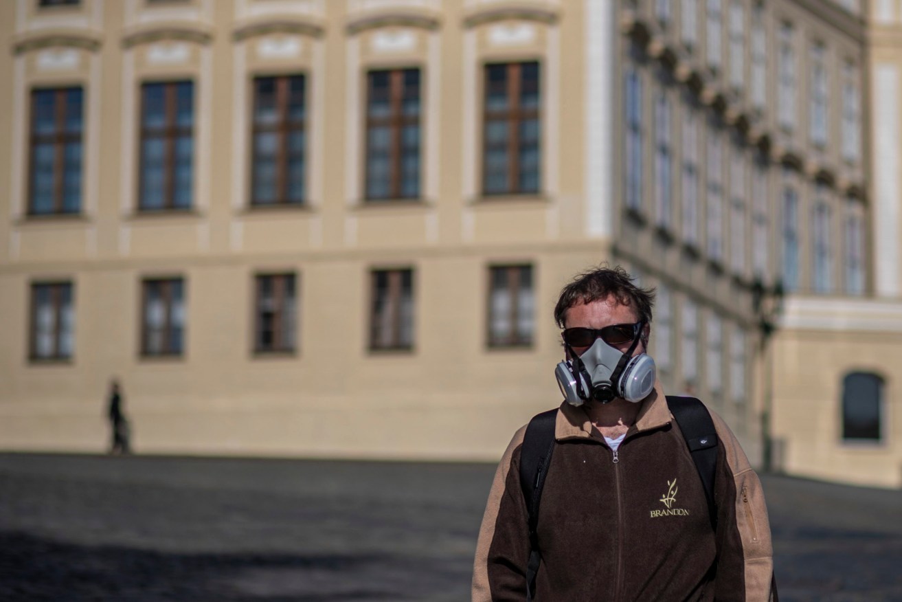 A tourist in Prague. Photo:   EPA/Martin Divisek